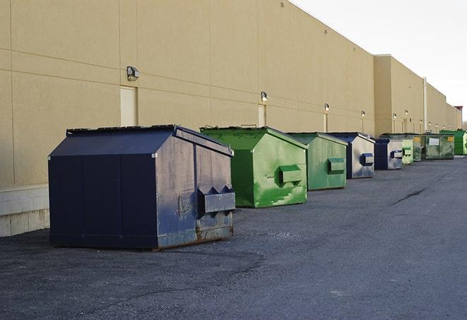 a variety of construction materials dumped haphazardly into a dumpster in Amery WI